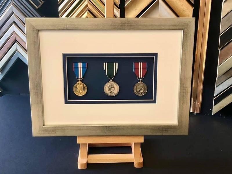 Medals awarded to a paramedic for long service and the Queenâ€™s Jubileeâ€™s 2002/2012. Framed with a distressed silver box frame, double mounted and glazed with Tru Vue reflection control glass.
