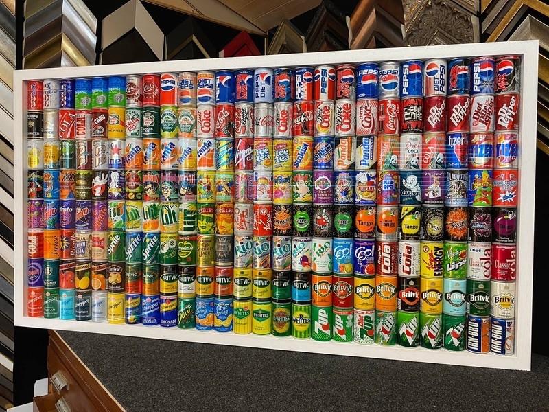 Something a bit unusual.. A collection of 400 Airline Miniature Soft Drinks Cans in a box frame